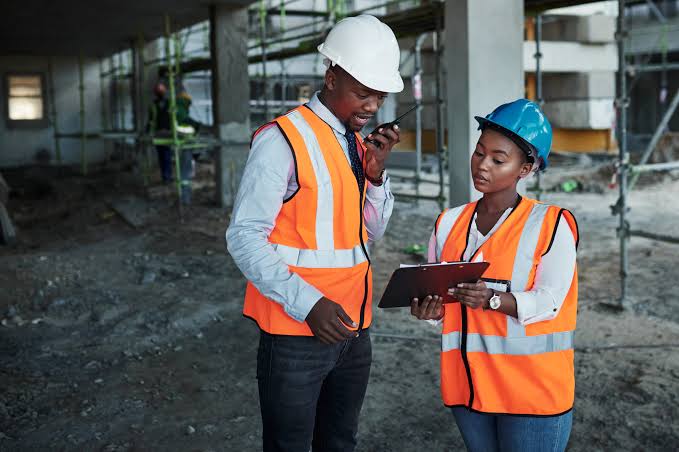 Site team coordinating work inside a building under construction